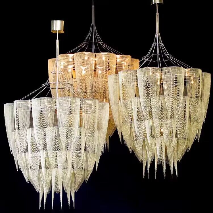A suspended chandelier inspired by the South Africa`s national flower the `Protea`. Made from lasercut stainless steel frames, chrome plated or lacquered, solid brass components and ballchain in several optional finishes More info on